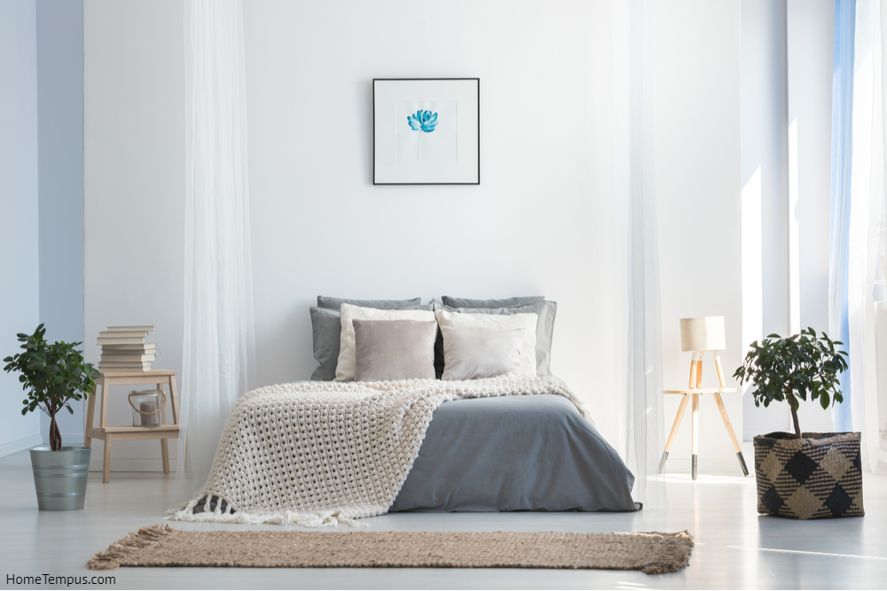 Knit blanket on king-size bed in natural warm bedroom of modern apartment in soft gray and blue colors - Grey Two Colour Combination for Bedroom Walls