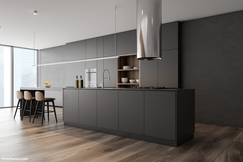 Corner of panoramic kitchen with concrete walls. Natural wood floor with dark kitchen cabinets