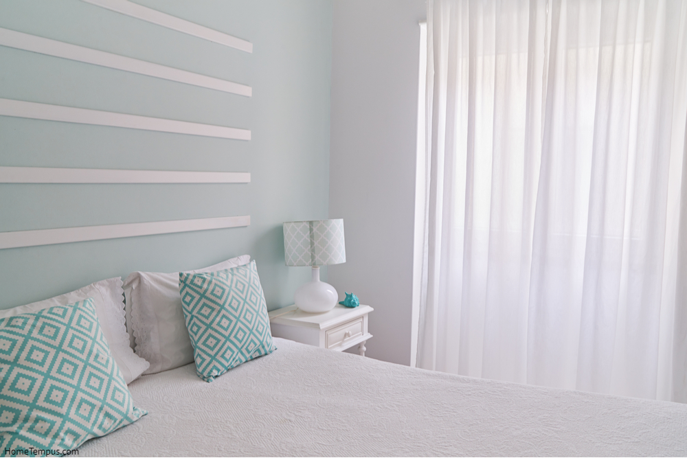 Shabby chic style mint pastel bedroom. Cozy bedroom with large window
