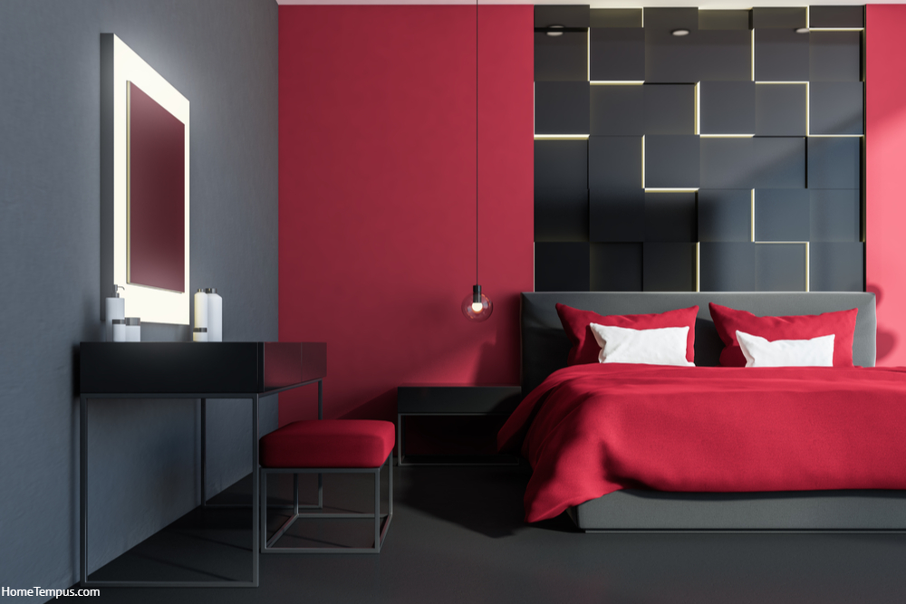 Stylish bedroom interior with red walls, a gray floor, panoramic windows, and a red double bed. Original wall lamps and a make up table. 