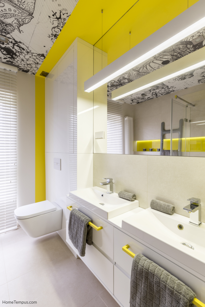 Yellow Bathroom Ceiling Idea - White and neon yellow bathroom design idea, yellow handles, double sink, toilet, graphic ceiling and window
